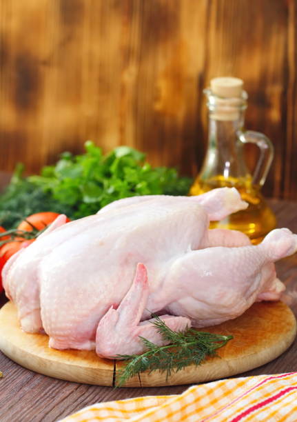 istock Raw chicken with vegetables and spices before cooking 681258258