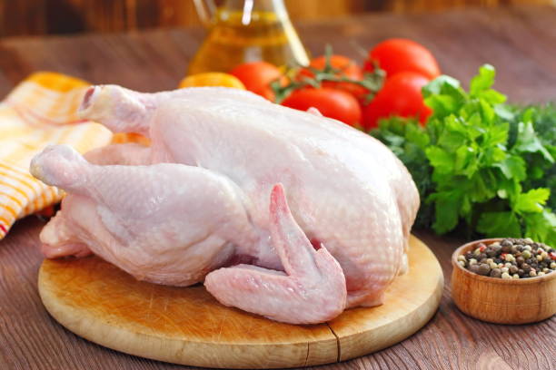 istock Raw chicken with vegetables and spices before cooking 681258262