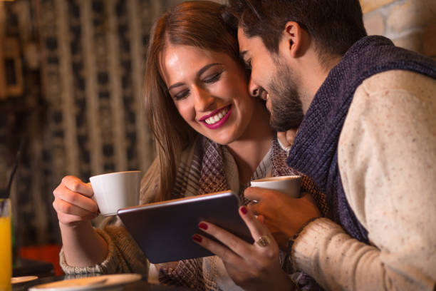 istock Beautiful young couple in cafe drinking coffee. 681264798