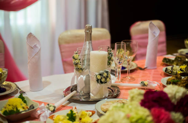 istock white and purple flowers, wedding accessories, wedding preparation, decorated wedding table with flowers, wedding flowers, wedding bouquet, food on the table,  decorated chairs, table and chairs, glasses, fruit, grapes, salad on the table 681265824