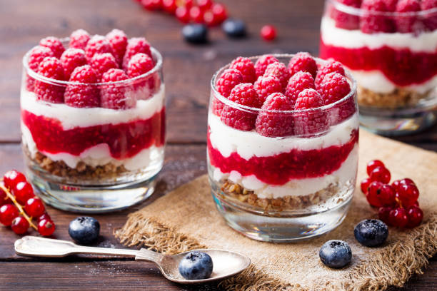 istock Raspberry dessert, cheesecake, trifle, mouse in a glass on a wooden background 681266106