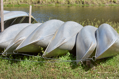 aluminum canoes stacked and docked ready for next 