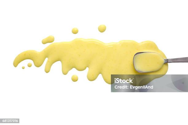 Splashes And Spilled Caesar Dressing With A Spoon Stock Photo - Download Image Now - Yellow, Sauce, Cream - Dairy Product