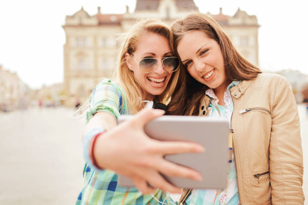 istock Young smiling women taking a selfie with tablet. Lifestyle, technology 681333028