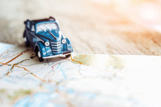 istock retro car on the map, tourism concept 681334666