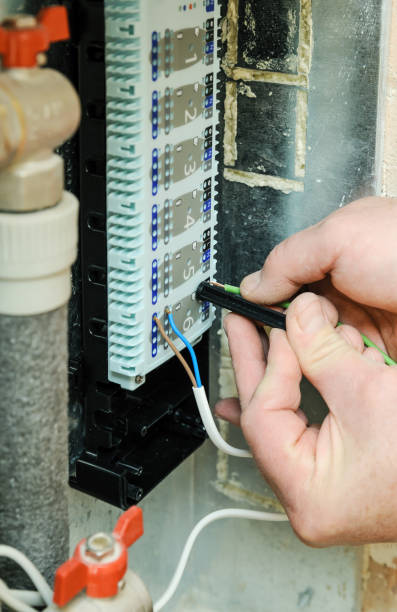 istock Switching signal wires in the home's heating system control. 681353966