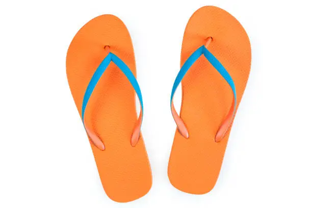 Photo of Orange Flip Flops Isolated On White Background. Top View