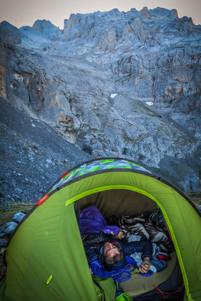 istock Preparation before climbing. Review of material and equipment. Stretching and exercises before climbing. Having a rest. Dreaming. Pico Llambrión desde Collado Jermoso. Picos de Europa, Asturias, Spain. 681364830