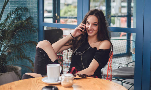 Brunette relaxing in cafe