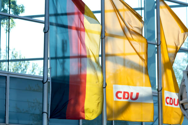 Berlin, Germany - May 7, 2017: German and Cdu flags Berlin, Germany - May 7, 2017: German and Cdu flags. Christian Democratic Union of Germany is a Christian democratic and liberal-conservative political party, the major catch-all party of centre-right campaign headquarters stock pictures, royalty-free photos & images