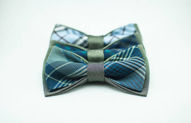 istock Three stylish green-blue bow ties on white background; isolated 681403220