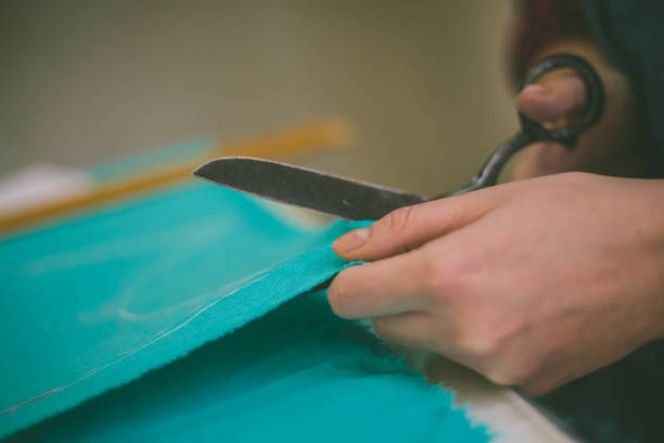 istock Seamstress woman preparing material 681408028
