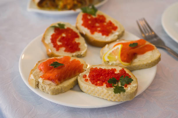 istock sandwiches with red caviar and red fish 681422086