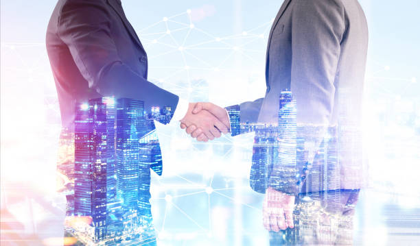istock Close up of two men shaking hands 681424362