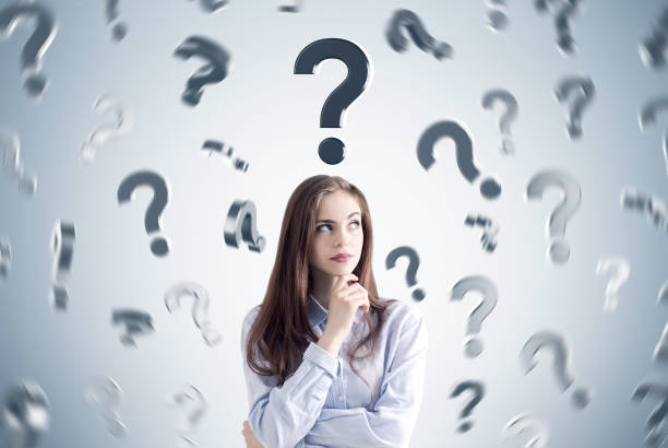 istock Pensive girl and many question marks 681438072