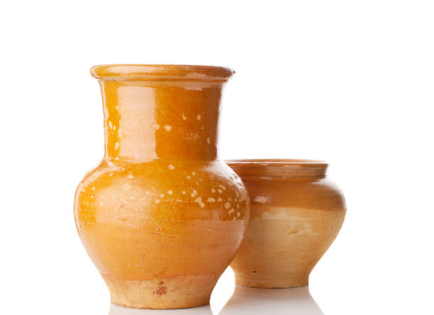 istock old jug and pot isolated on white 681482842
