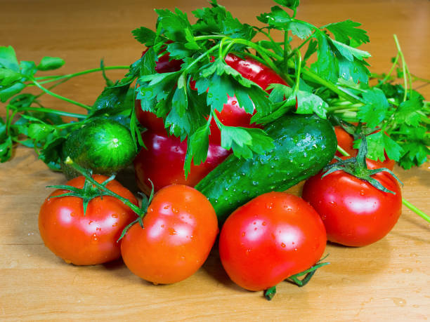 istock Fresh vegetables and herbs on a wooden table 681494118