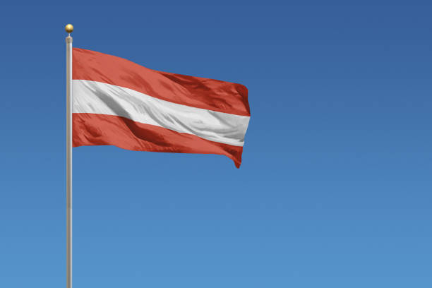 istock National flag of Austria on a clear blue sky 681494474