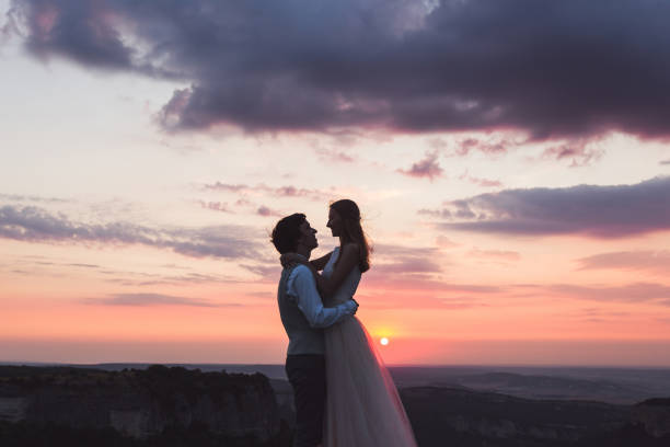 istock Bride and groom at beautiful sunset in the mountains 681506448