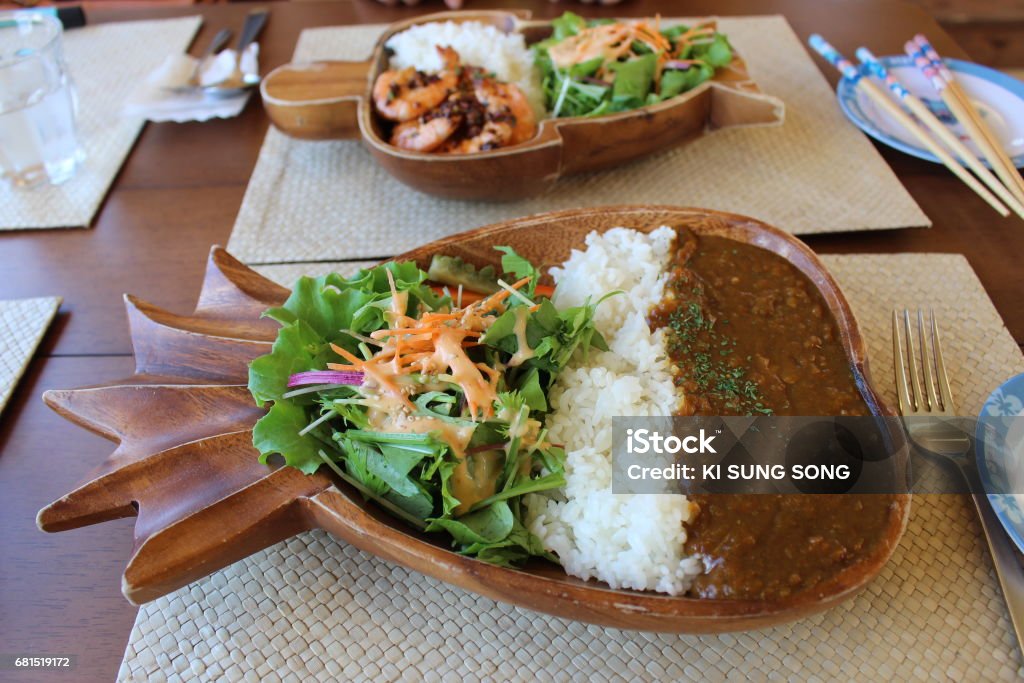 Japanese style curry rice with vegetables in a pineapple - shaped bowl. Japanese style curry rice with vegetables in a pineapple - shaped bowl. Taken from a restaurant in a Miyako jima island, Okinawa, Japan. Curry Soup Stock Photo