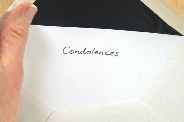istock Condolences, receiving a letter in envelope, hand holding for reading 681521282