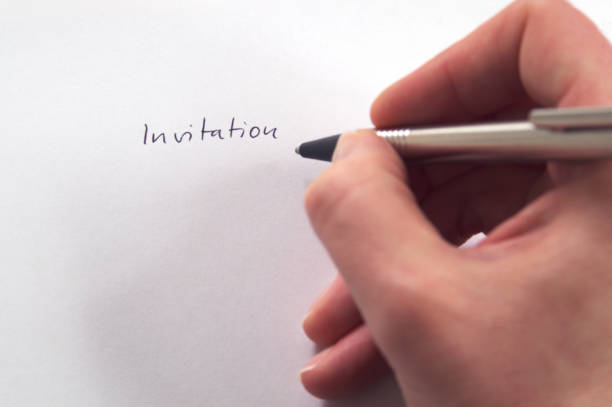 istock Hand writing Invitation in handwriting on white paper 681523562