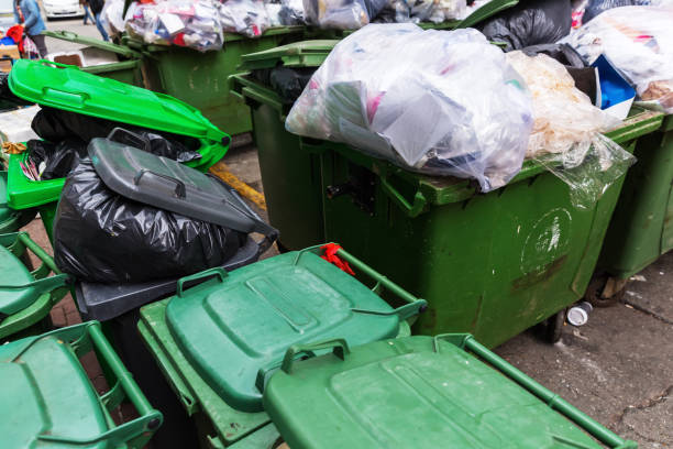 istock lot of filled green waste containers 681556732