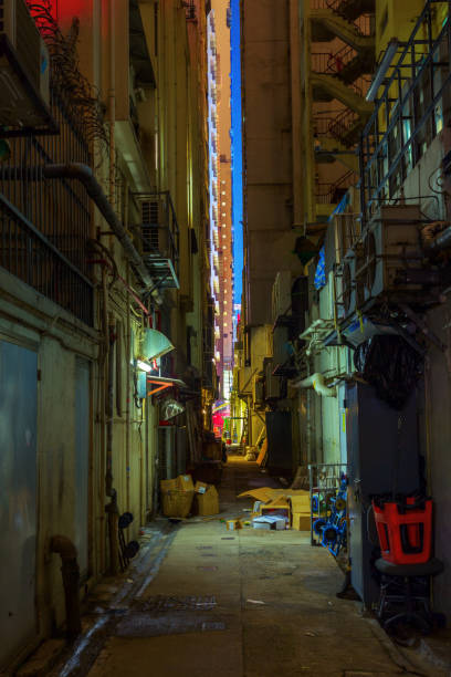 istock backstreet in Kowloon, Hong Kong, at night 681556962