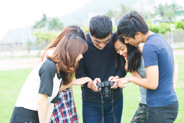 istock Friendship - Five friends take photos on the camera 681596498