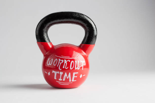 istock Red kettlebell with Workout Time lettering written on it isolated on white with copy space 681605496