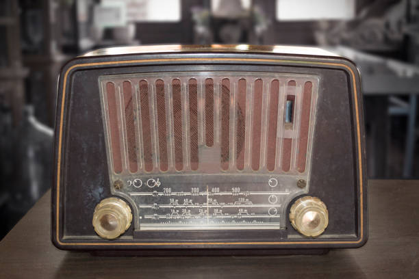 istock Vintage radio on wooden table. 681614938