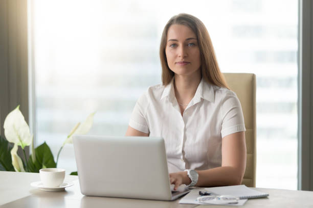 istock Female office worker doing daily work on laptop 681615288