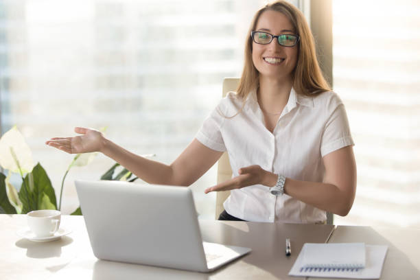istock Friendly receptionist invites visitors on meeting 681615404