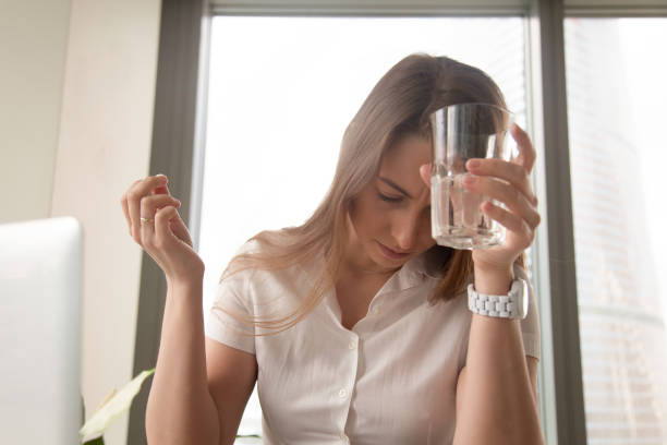 istock Businesswoman suffering from headache at workplace 681615484