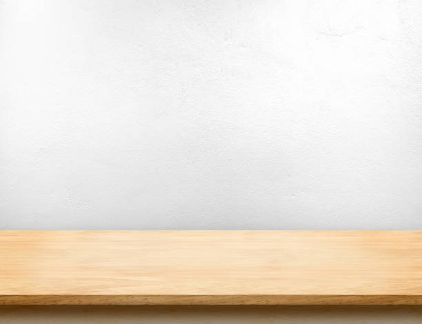 istock Wood table top with white paint concrete wall,Mock up template for display or montage of product 681616010