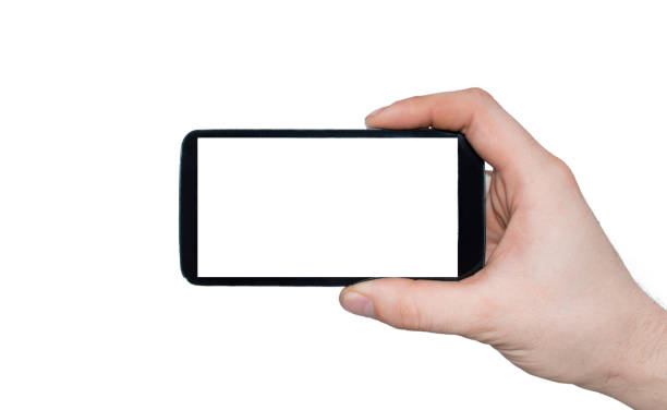 istock A man  hand holding smart phone making photo isolated on white background. 681618574