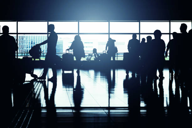 istock Silhouette of people moving in the lobby 681622200