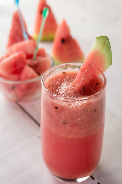 istock watermelon juice on wood white background 681624868