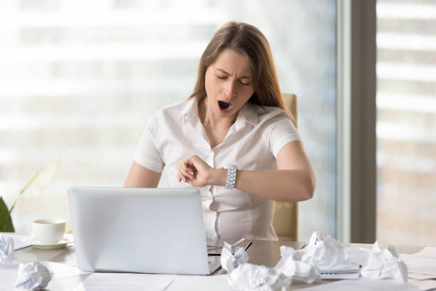 istock Tired businesswoman waiting working day ending 681625390