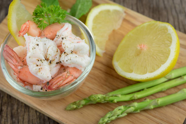 istock Food Shrimps. Prawns with lemon .Seafood 681625780