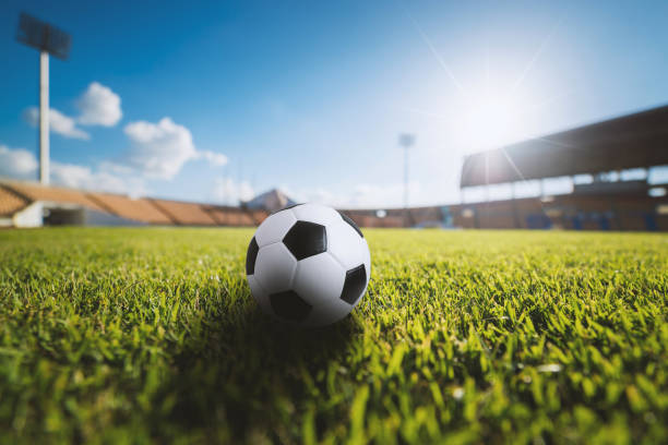 istock Soccer ball on the grass in soccer stadium 681626202