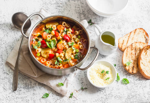 istock Vegetarian minestrone - delicious healthy mediterranean lunch. On a light table, flat lay 681629634