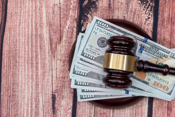 istock us dollar with wooden hammer on desk. 681639714