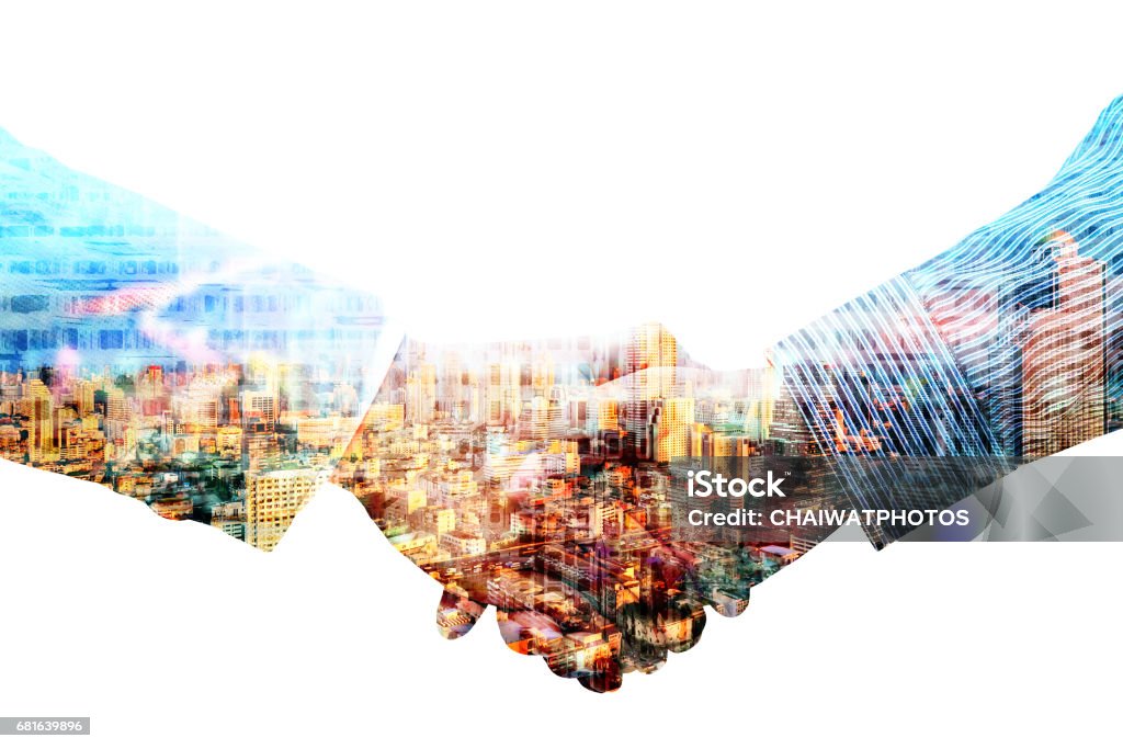 Double exposure of handshake with night city blured background. Agreement Stock Photo