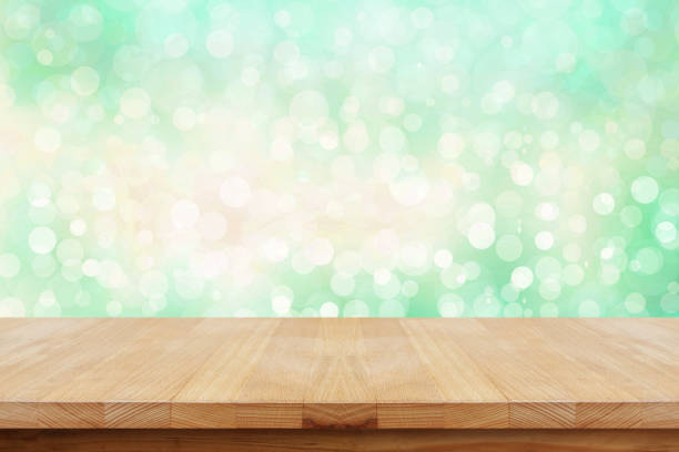 istock Wooden table on natural green background. 681640538