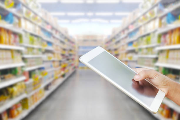 istock Woman checking shopping list on tablet 681642814