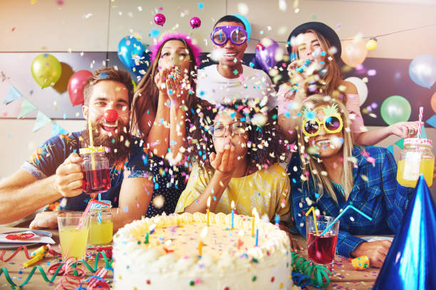 istock Festive partygoers surrounded by confetti 681642856