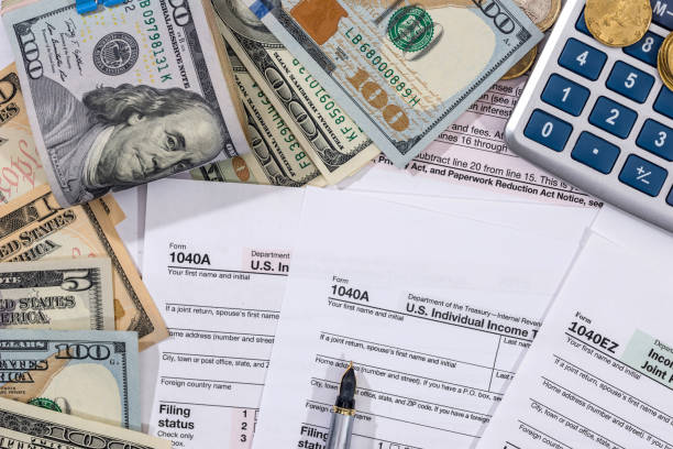 istock Filing taxes form, money, calculator and pen. 681642904