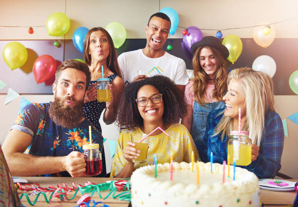 istock Laughing group of young friends celebrating 681642972