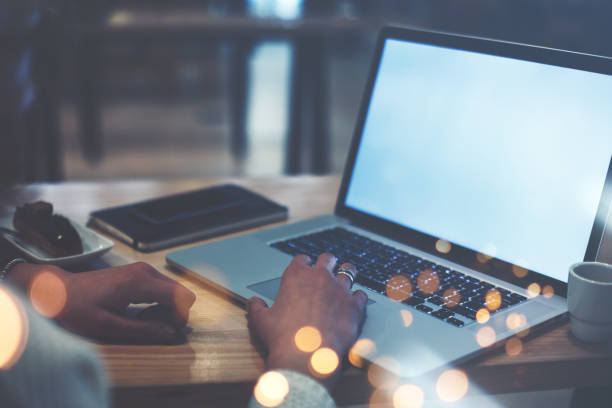 istock business lady in cafe using laptop and mobile phone 681646980